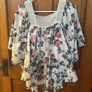 Pancho style blouse with pink and yellow roses and a appliqué neckline